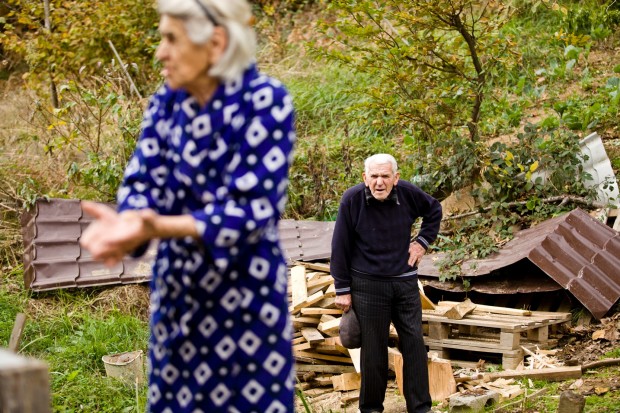 Polina Kalayzhan, 85, and her husband live in a house that's slowly sliding down hill. | Abbas Atilay